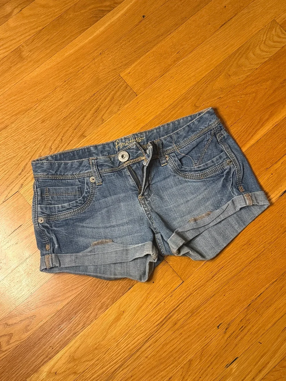 Rare vintage Y2K Amethyst Jeans ultra-low-rise denim shorts in a medium-wash blu